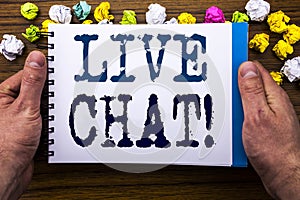 Writing text showing Live Chat . Business concept for Communication Livechat written on notepad notebook book on the wooden wood b photo