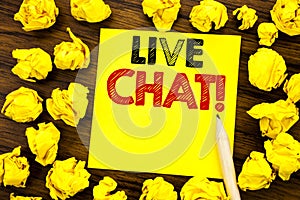 Writing text showing Live Chat . Business concept for Communication Livechat Written on sticky note paper, wooden background with photo