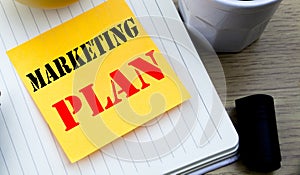 Writing text showing Marketing Plan. Business concept for Planning Successful Strategy written sticky note empty paper, Wooden bac