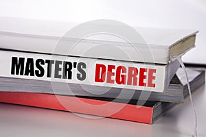 Writing text showing Master s Degree. Business concept for Academic Education written on the book on the white background.