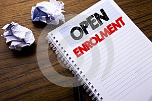 Writing text showing Open Enrolment. Business concept for Medicine Doctor Enroll written on notebook notepad note paper on the woo