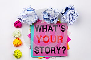 Writing text showing Question What Is Your Story written on sticky note in office with paper balls. Business concept for Sha