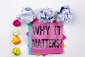 Writing text showing Question Why It Matters written on sticky note in office with paper balls. Business concept for Motivat
