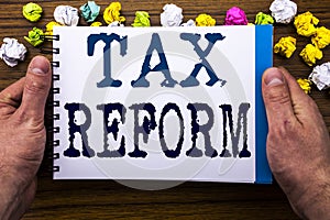 Writing text showing Tax Reform. Business concept for Government Change in Taxes written on notepad notebook book on the wooden wo