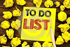 Writing text showing To Do List. Business concept for Plan Lists Remider Written on sticky note paper, wooden background with fold