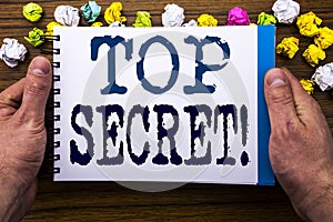 Writing text showing Top Secret. Business concept for Military Top Secret written on notepad notebook book on the wooden wood back
