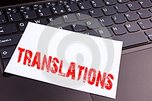 Writing Translations text made in the office close-up on laptop computer keyboard. Business concept for Translate Explain Plead B