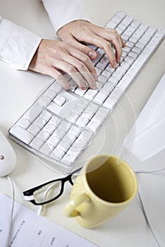 Writing on a white computer keyboard