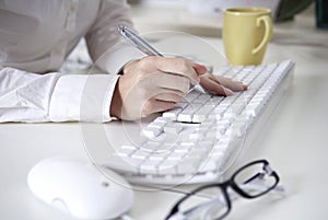 Writing on a white computer keyboard