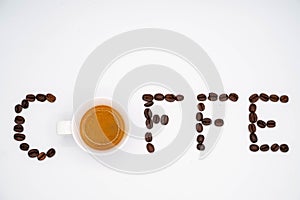 Written CaffÃ¨ with coffee beans and a cup of coffee instead of the letter O photo