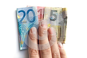 2015 written with euros bank notes in a hand