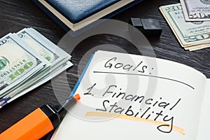 Written goals financial stability on the page.