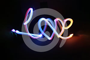 written love in neon photo