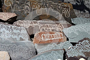 written mantra on buddhist mani stones