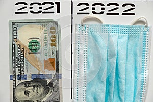 2021 and 2022 written in pen over a column in two separate columns, dollars and a medical mask, subtotal photo