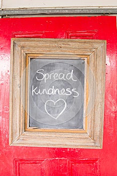 A written quote in a chalked board frame