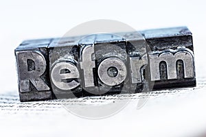 Written reform in lead letters photo