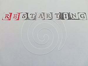 Written restarting on a white background