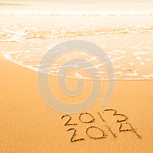 Written in sand on beach texture, soft wave of the sea.