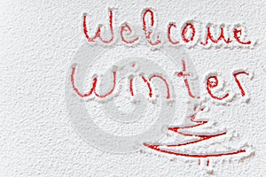 Written `Welcome winter` on the snow