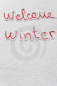 Written `Welcome winter` on the snow