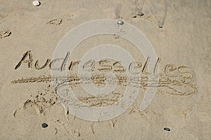 Written word audresselles in the sand at the beach audresselles in france