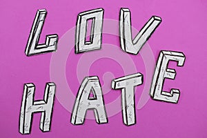 Written words love and hate, white on a pink background