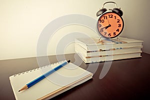 Writter equipment on desk with deadline clock photo