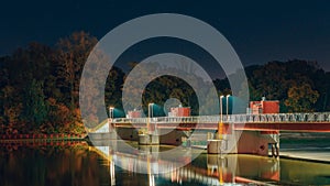 Wroclaw, Opatowice weir on the Odra river illuminated at night with the possibility of crossing to the other bank of the river.