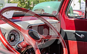 WROCLAW, POLAND - August 11, 2019:  USA cars show: 1951 Renovated Ford F-100 Pickup Truck of red and white colors. Close-up of