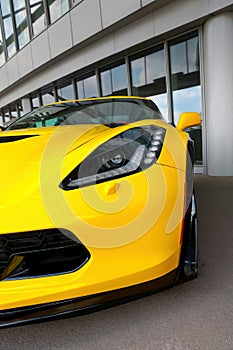 Wroclaw, Poland, August 25, 2021: Front view of a yellow fast car. Beautiful modern muscle car. Expensive cars.