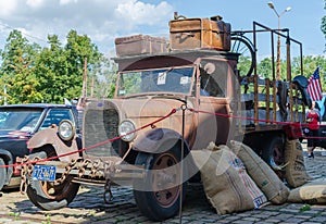 WROCLAW, POLAND - August 11, 2019: USA cars show - Old Ford truck pickup 1930 - 1931-1939 with stylish vintage suitcases and few