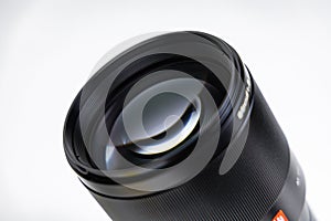 Wroclaw, Poland - December 19 2023: Camera lens for mirrorless Canon camera with RF mount Viltrox RF 85mm f1.8 STM on white