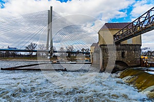 Redzinski weir over Odra river in front of Redzinski highway bridge at sunny cloudy day