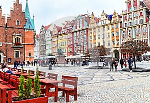 Wroclaw, Poland - October 17, 2015: People walking and resting on the famous, old market square in Wroclaw.