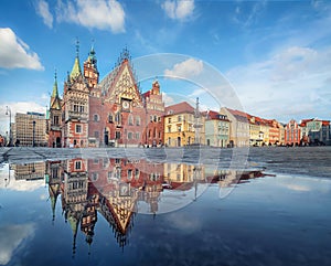 Wroclaw, Poland. Town Hall building reflecting in puddle