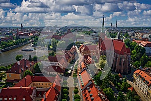 Wroclaw, town in Poland, sunny day in summer. Blue sky with white clouds. Uraban landscape, aerial picture above historical