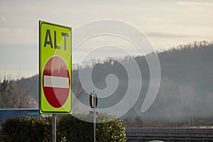 Wrong or one way signal on italian motorway with writing alt or stop. High visibility color of one way road on motorway