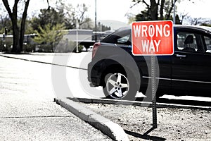 Wrong Way Parking Sign for Direction in Car Lot