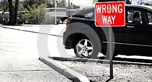 Wrong Way Parking Sign for Direction in Car Lot