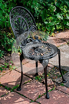 Wrought cast iron chair in the garden black color