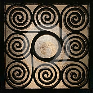 Wrought Greek iron grille made of spirals