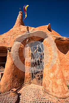 Wrought iron artisan door on clay house