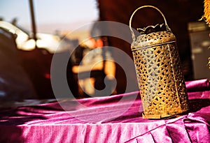 wrought iron berber lamp with traditional nomad tents on background