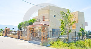 Wrought iron fence around house.