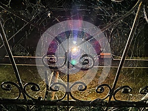 wrought iron fence of the railing in night dark black time and lantern as star on background. Abstract Pattern, frame