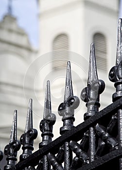 Wrought iron fence and Saint Louis Cathedral in New Orleans