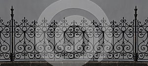 wrought iron fence in Victorian style. Seamless decorative element. An artistic vintage fence with circular decorative symbols in