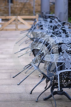 Iron furniture stacked up ready to be brought out for summer