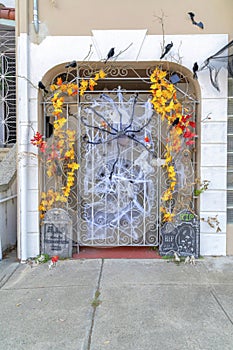 Wrought iron gate with holloween decorations in San Francisco, California